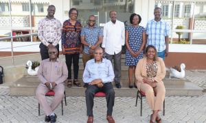 CEO pose for a photo with visitors at the complex